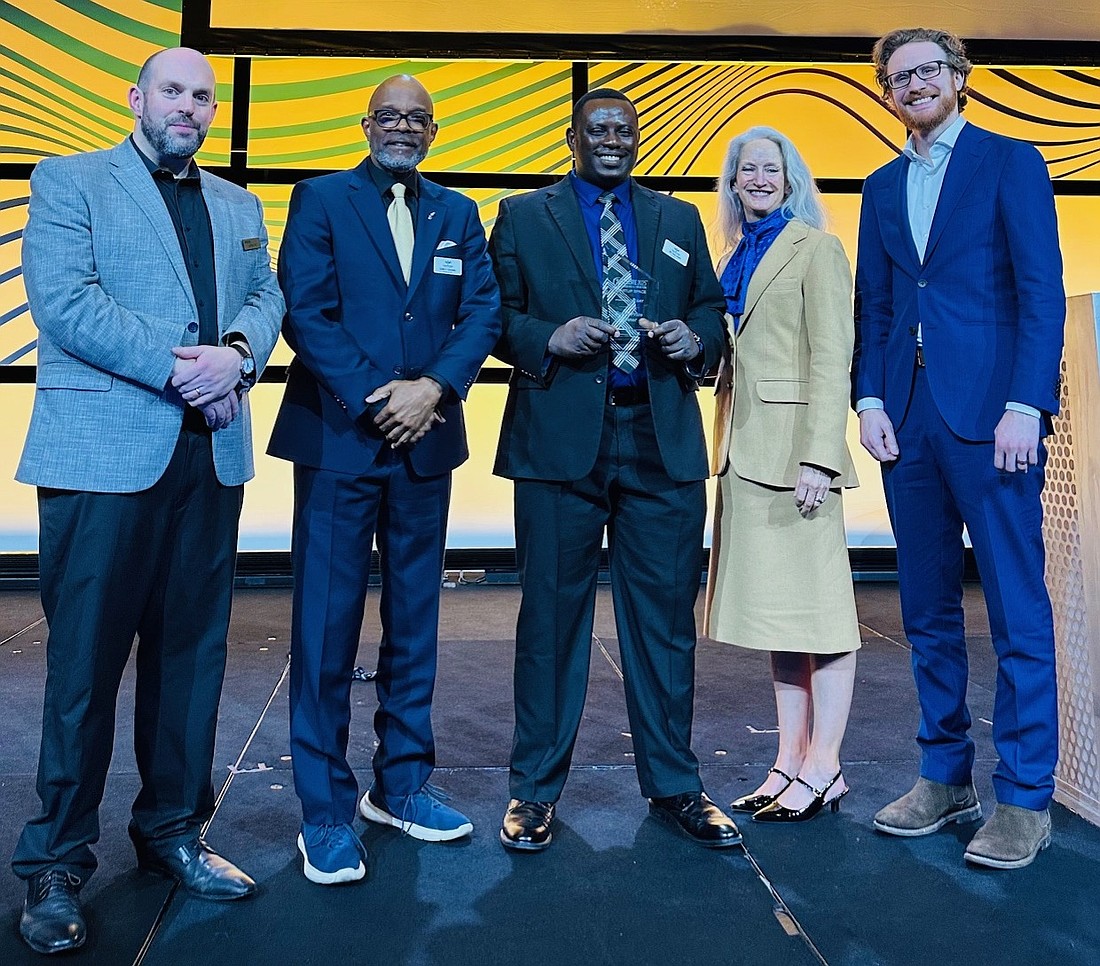 Palm Coast resident Leslie F. Giscombe (second from the left) is Phemotron Systems' president and chief business officer. Courtesy photo