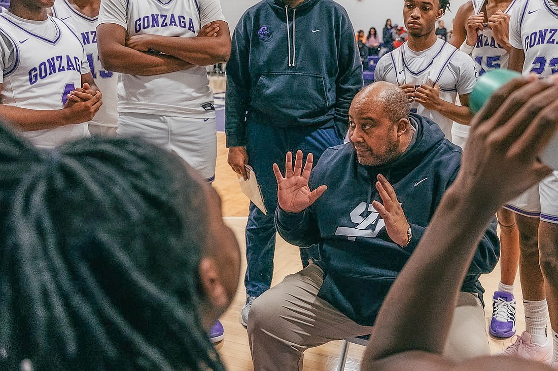New Montverde Academy basketball coach Steve Turner coached up his former Gonzaga College High team during a timeout.