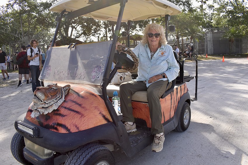 Kay Rosaire, founder of Big Cat Habitat, shows off her own wheels at Sarasota Cars and Coffee Gone Wild April 5.