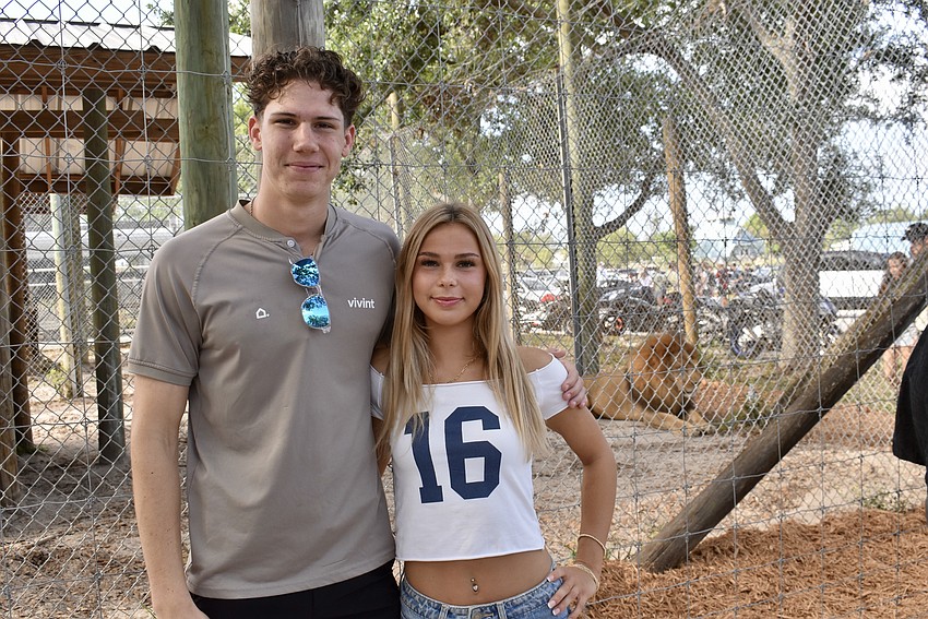 Bradenton's Jackson Morgan brings Parrish's Angelina Rogers to her first Cars and Coffee at Big Cat Habitat April 5.
