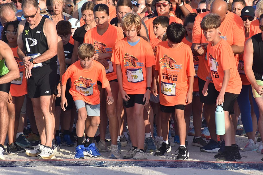Racers prepare to begin the 5K. Front: Danny Withers, Noah Mahrenholz, 9, Sawyer Fleming, 11, and Phoenix Gomez, 12 and Jonah Kindred, 12