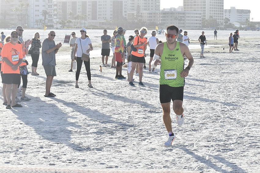 Sebastian Kovendy, the overall winner, comes in for the finish line.