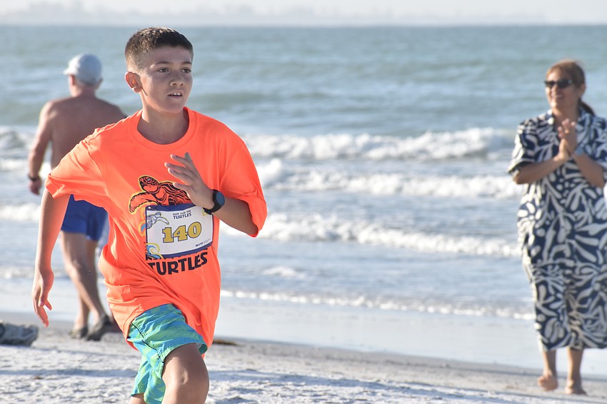 Rocco Baley, 12, speeds toward the finish line.
