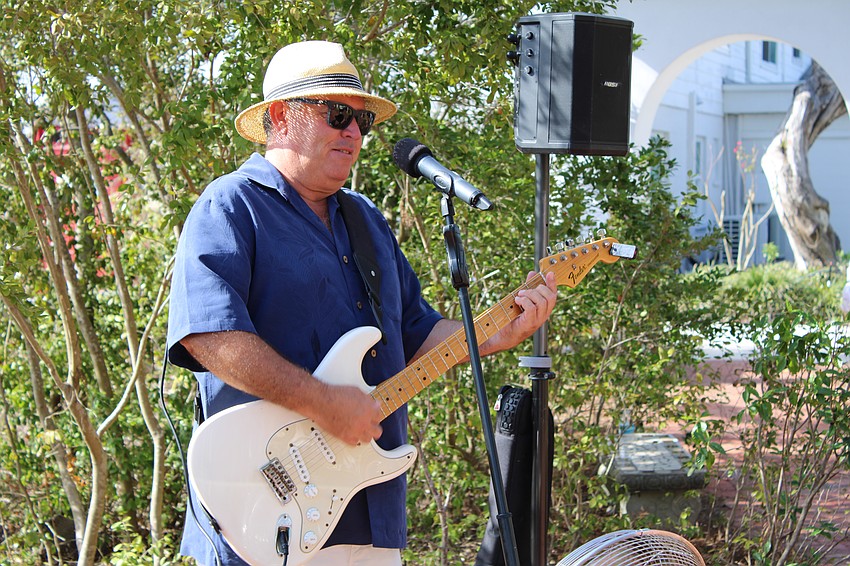 Musician Mike Sales opens the Artists in the Garden showcase.