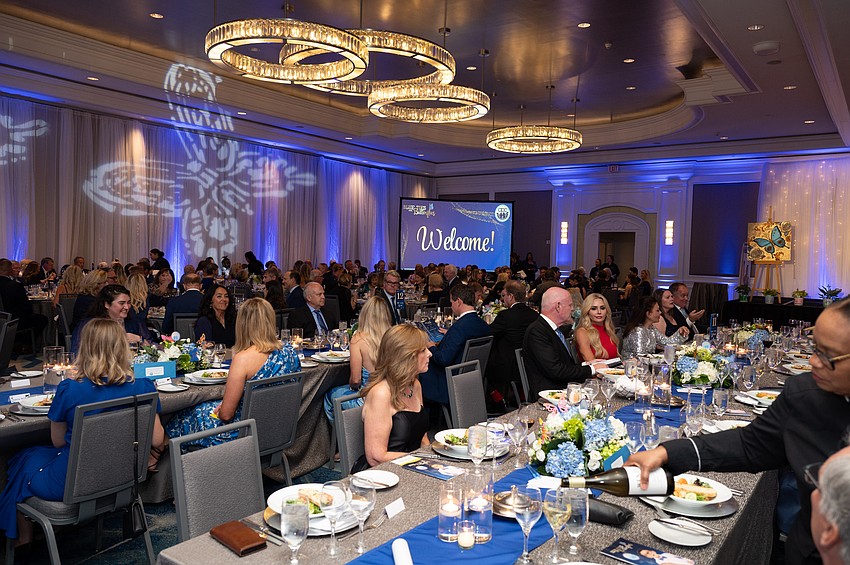 Guests sit down for dinner.