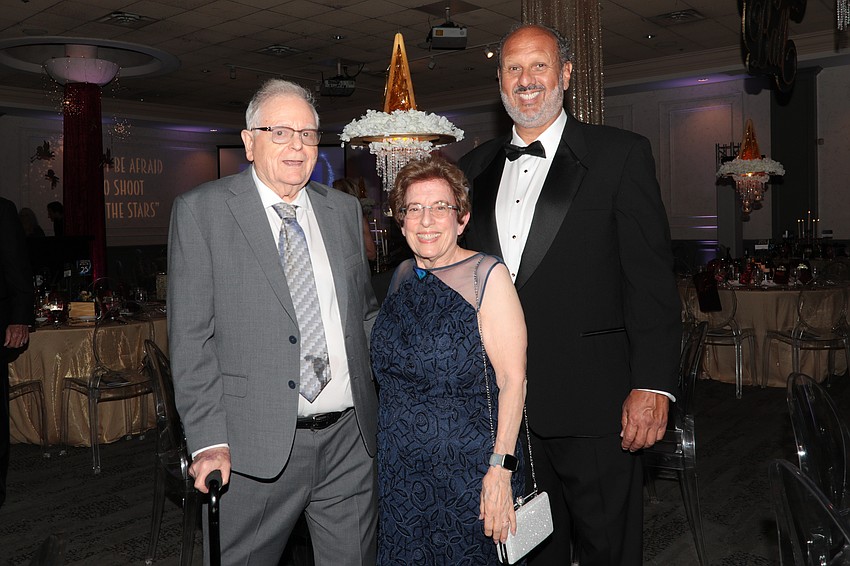Tom and Kathy Cook with CEO Philip Tavill