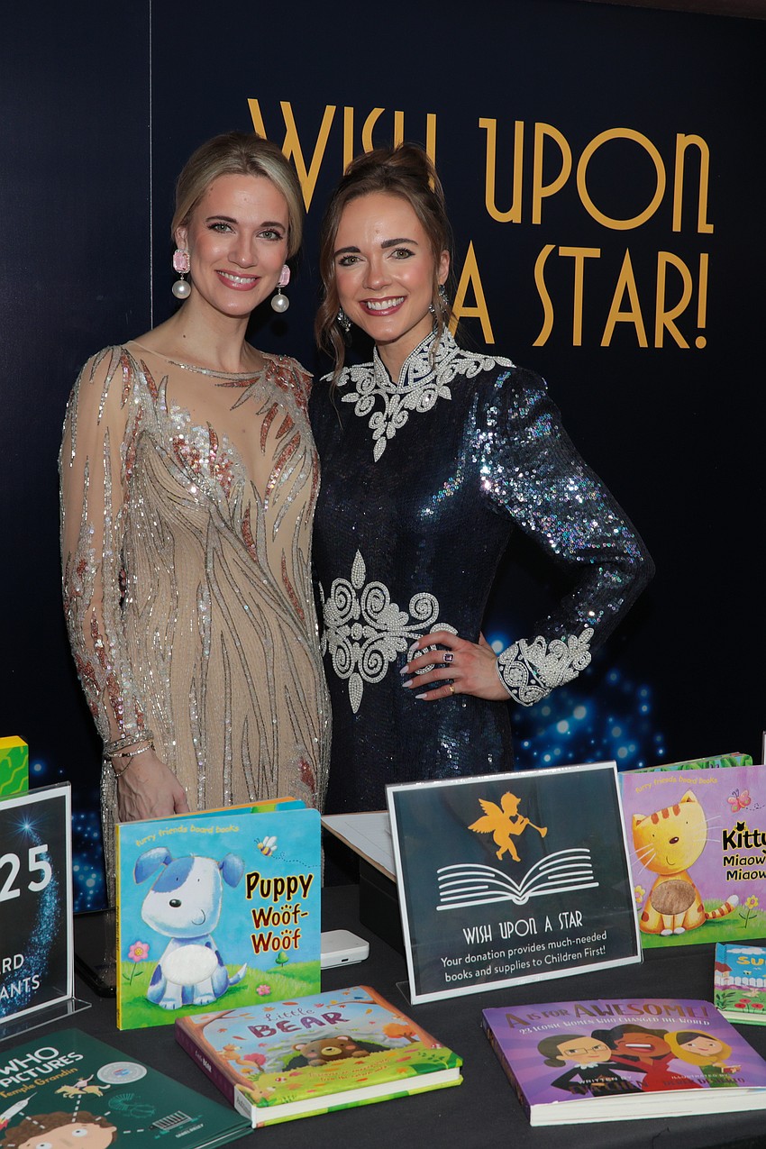 Sarasota sisters Candice and Lauren Henry volunteer to help with donations to the Children First library.