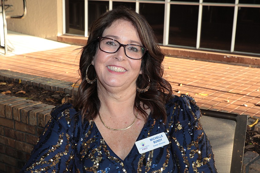 Michelle Bundy registers guests as they arrive for the Children First Fairytale Ball on April 5.