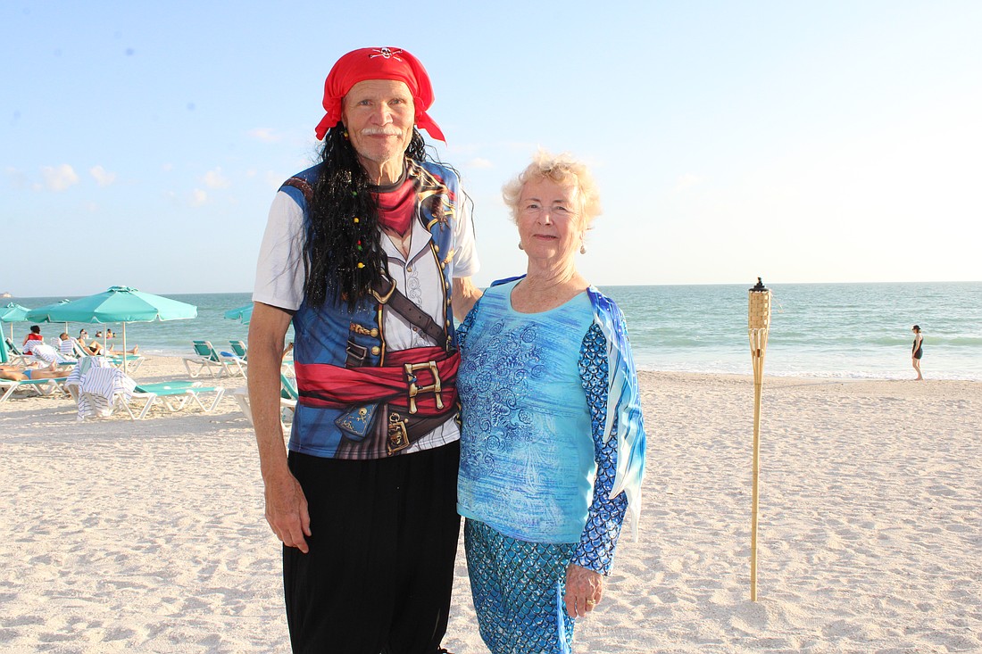 Dennis and Jody Matthier dress to the nines for the pirates and mermaids-themed beach party closing out the peak season for the Lido Key Residents Association.