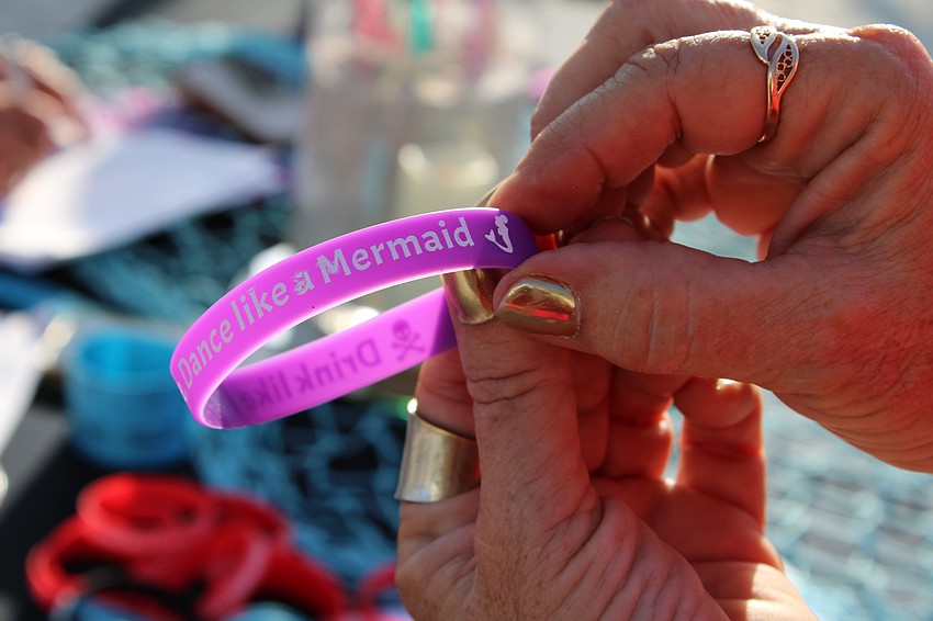 Diane Sterner shows the maritime-themed swag for the beach party.