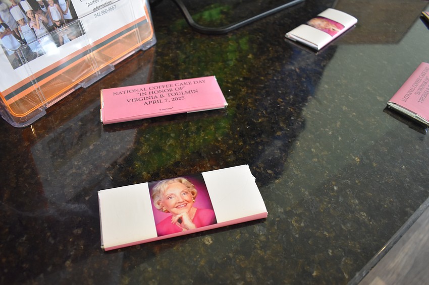 Chocolate bars wrapped in honor of Virginia B. Toulmin are displayed at the event.