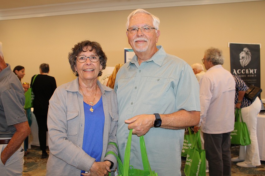 Longtime Longboat Key residents Tom and Jackie Michaelides said they especially enjoyed the booth by Mary Lou Johnson Photography.