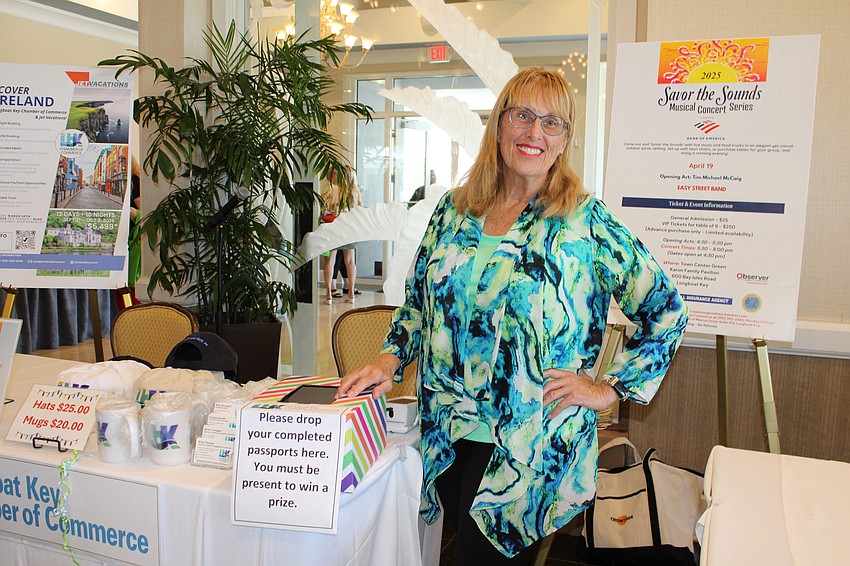 Connie Darrah from the Longboat Key Chamber of Commerce helps attendees with their event passports.