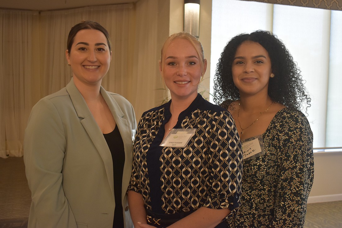 Christiana Hershberger, Emily Goodie and Marina Perez each received a $3,000 scholarship from the Palm Aire Women's Club. Ashley Lewis, who also received a scholarship, was not present.