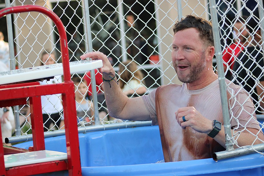 Rite Technology's Wayne Parrish, representing the Lakewood Ranch Business Alliance, was the dunkee, in a carnival style game during the Block Party and Club Day April 11 at Main Street at Lakewood Ranch.