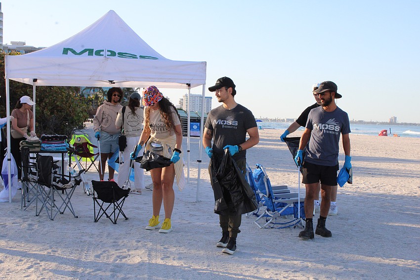 Volunteers from the construction company Moss and the engineering firm Kimley-Horn collaborated to cleanup Lido Beach.