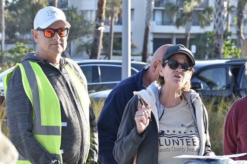 Site leaders Jerry and Penny Long start the cleanup.