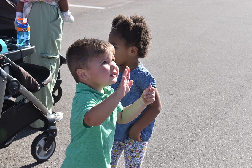 Lincoln Naser,3, gives a wave to the Easter Bunny.