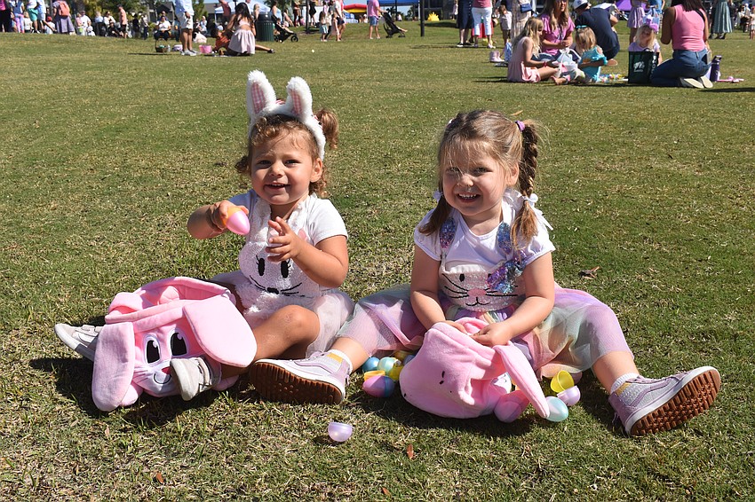 Olivia Begon, 2, and Chloe Begon, 4, check out the candy that is inside their eggs.