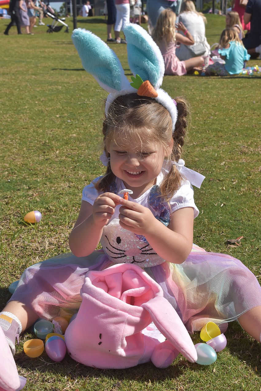 The eggs have been collected and now it's candy time for 4-year-old Chloe Begon during Eggstravaganza at Waterside Park.