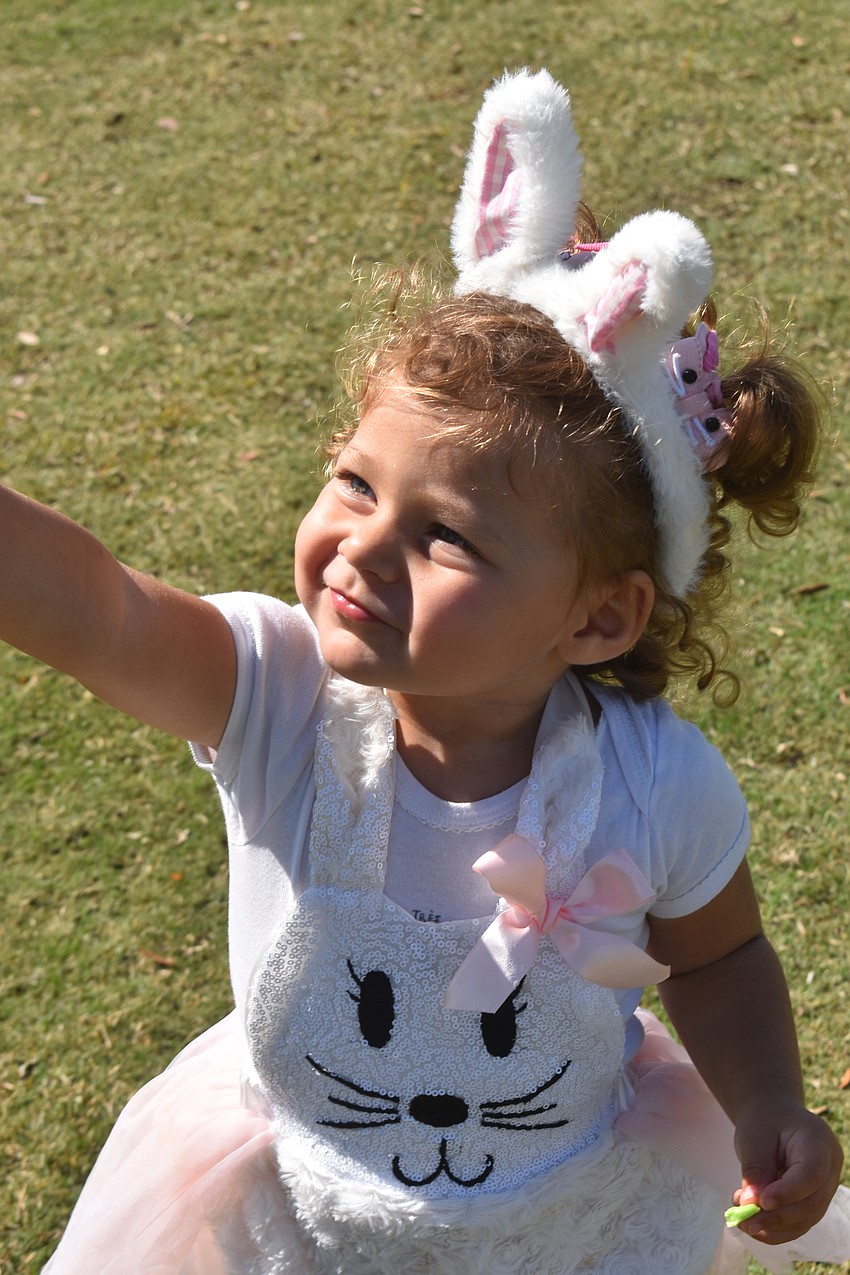 Olivia Begon, 2, is ready to hop for eggs.