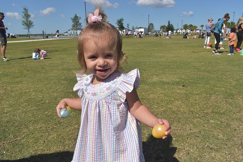 Ivie Petrov, 1, has her hands filled with eggs during Eggstravaganza.