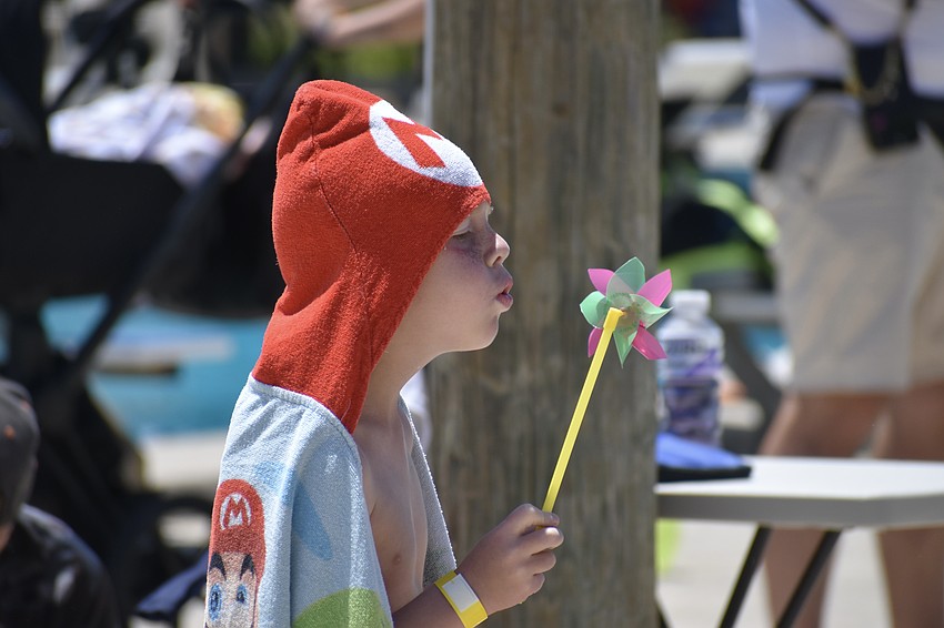 Maverick Horton, 7, enjoys the whirligig he received for a prize.