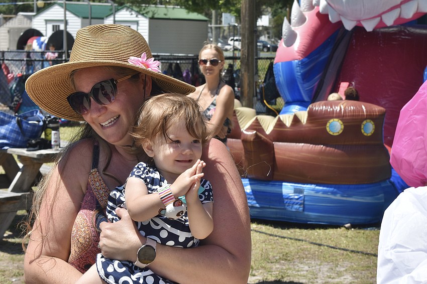 Rachael Winzeler and her daughter Brianna Winzeler, 1, meet the Easter Bunny.