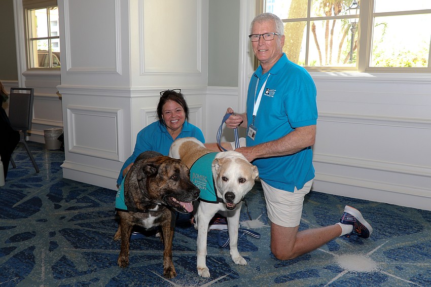Kim and Jonathan Reed with their rescue pups Tucker and Jack.