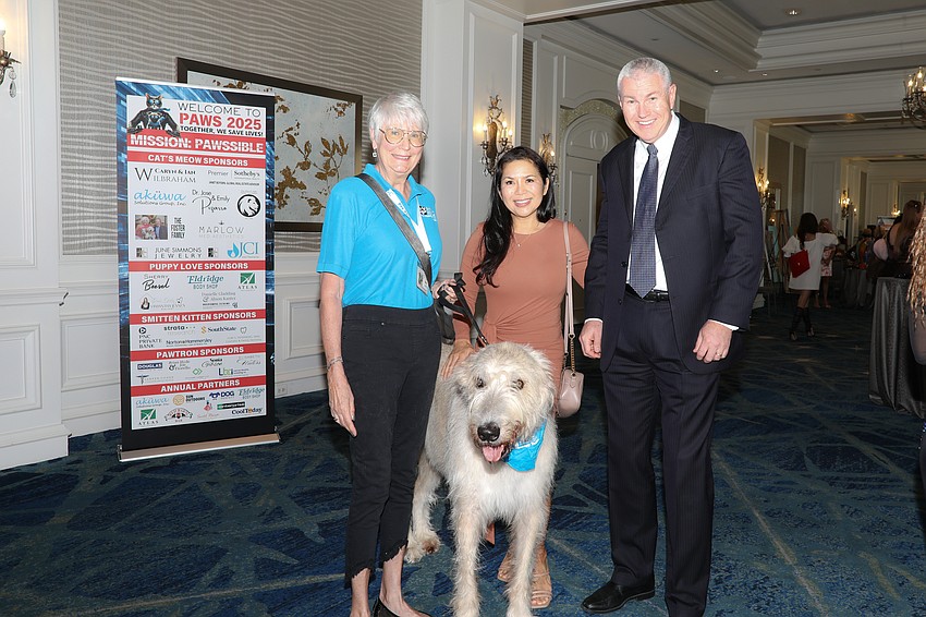 Mary Jones with her Irish wolfhound Al, and Cori and Harald Hvideberg.