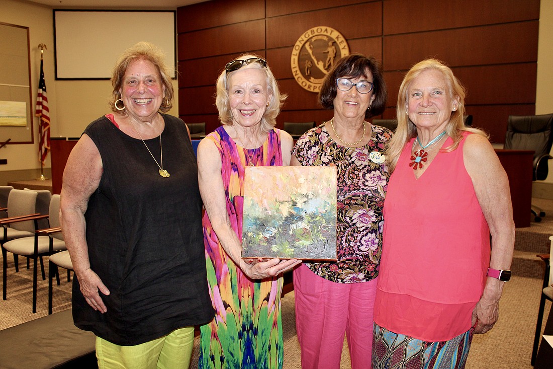 Sisters Marilyn Woodstock, Paula Piekos and Jan Owens pay a visit to their favorite artist, Pat Lundy, at the annual Longboat Key Town Hall Art Exhibition and Artists' Reception.
