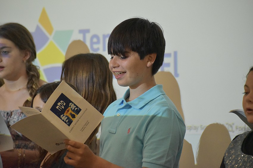 Jonas Schechter, 13, sings in a group performance.