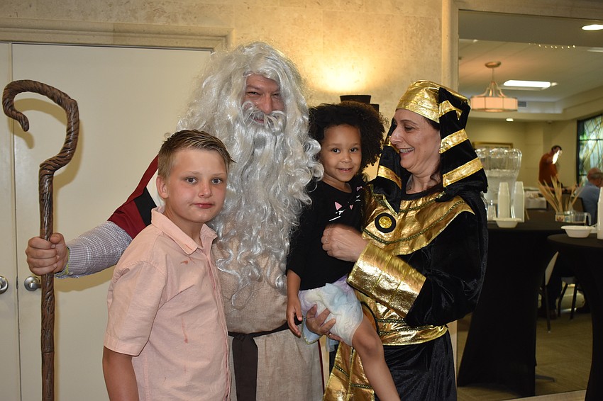 Ryan Yonker, 13, Rabbi Michael Shefrin, Yonker's cousin Mila Gordon, 4, and Snait Ben-Herut gather together.