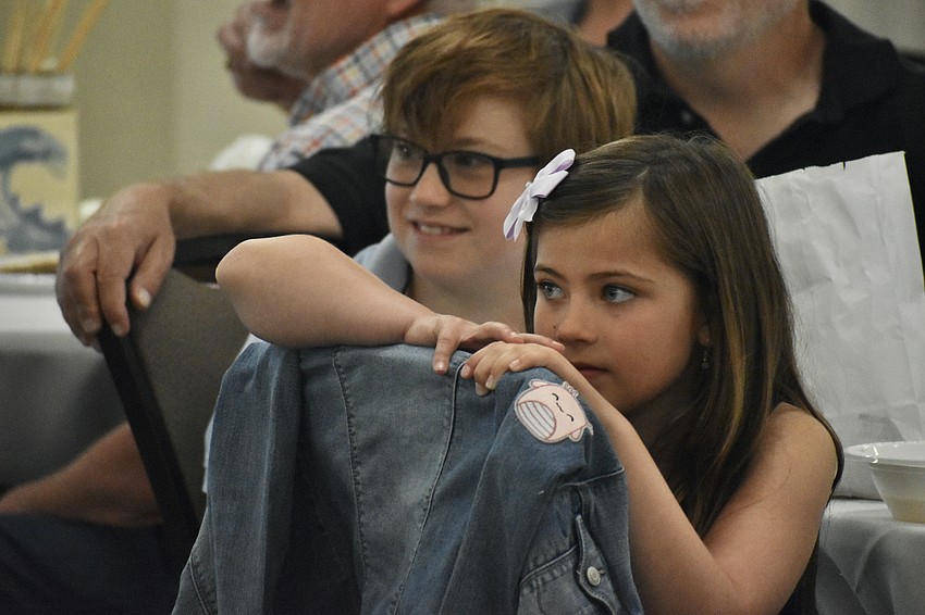 Noah Dieterle, 10 and his sister Lucy Dieterle, 8, watch a video on Passover.
