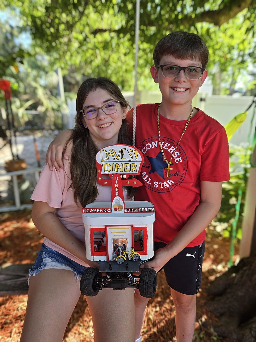 Seventh grader Layla Loeffel and her brother, fifth grader J.D. Loeffel, created a car themed after a 1950s diner.
