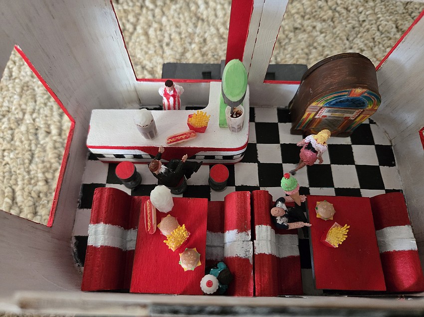 Seventh grader Layla Loeffel and her brother, fifth grader J.D. Loeffel, created a car themed after a 1950s diner.