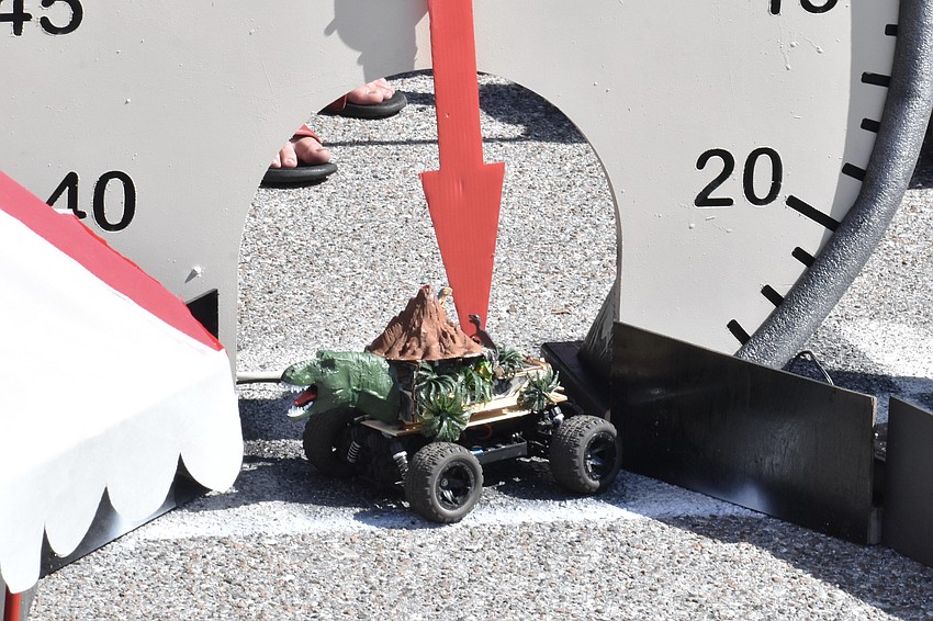 A race car tries to make it through the finish line of the drag race.