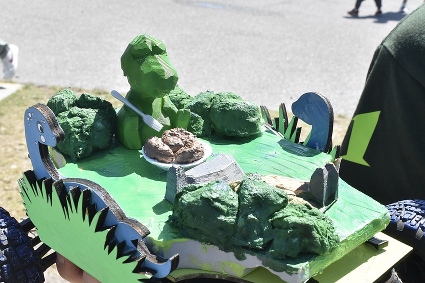The car by fifth graders Cameron Coff and Riley Thomas featured a 3D-printed dinosaur enjoiyng a meal.