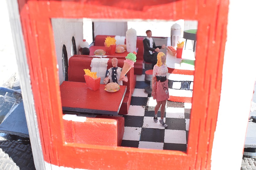 Seventh grader Layla Loeffel and her brother, fifth grader J.D. Loeffel, created a car themed after a 1950s diner.