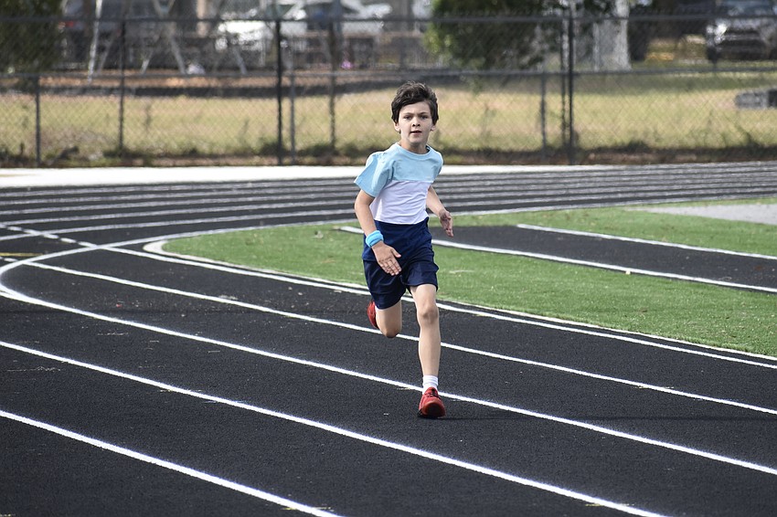 Anthony Bowers, a second grader, races on the track.