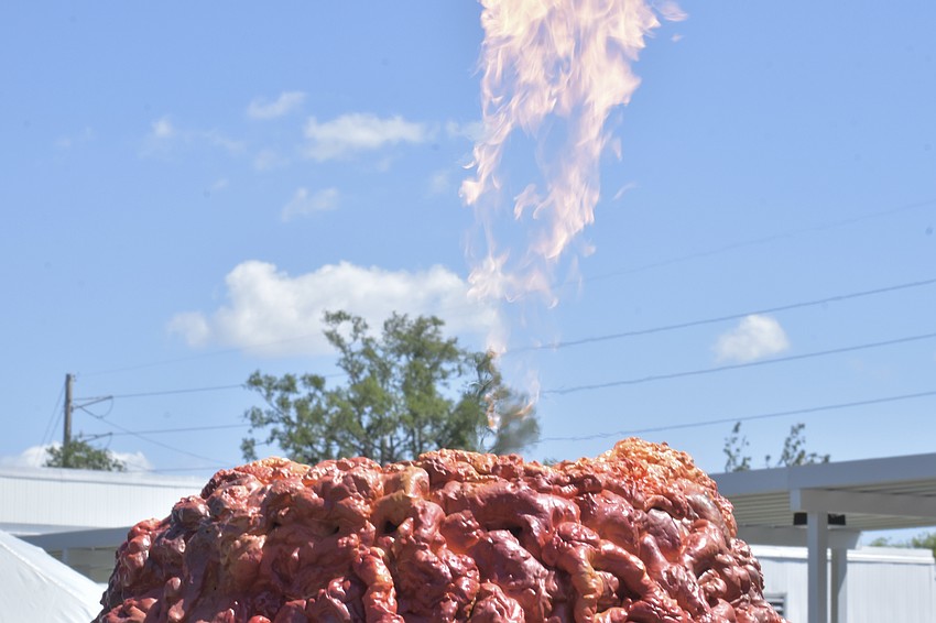 A spurt of fire comes from the volcano on the obstacle course.