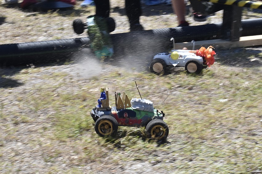 Cars make their start on the obstacle track.