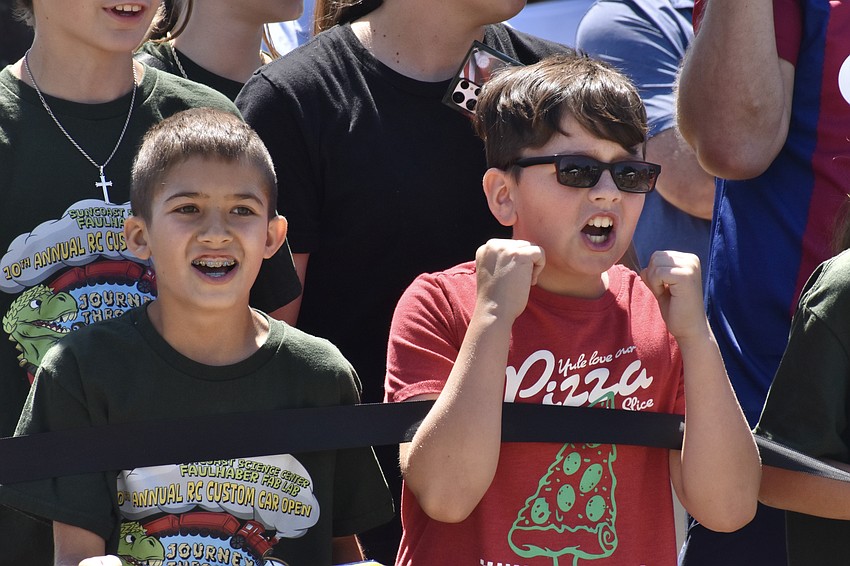 Cam Bedi and Evan Gray cheer on their friends in the race.