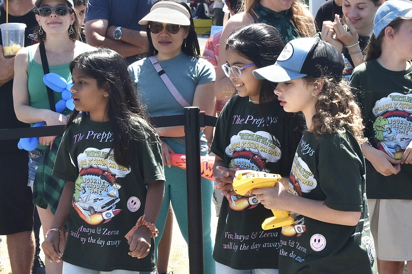 Zeeva and Anaya Patel, and Vivian Trotter race their car.