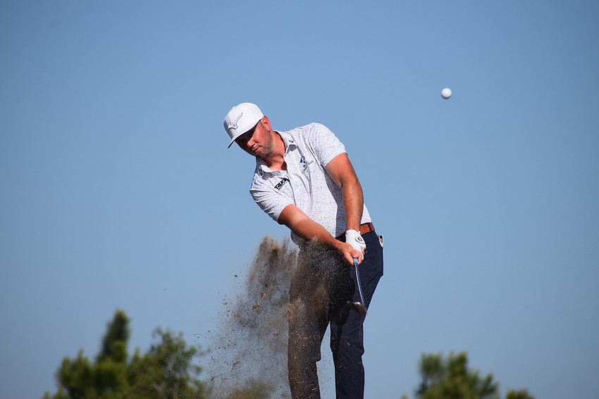 Tanner Gore hits a near-perfect chip on No. 14. Gore finished at 9-under 62 to put him in second place after the first round of the LECOM Suncoast Classic.