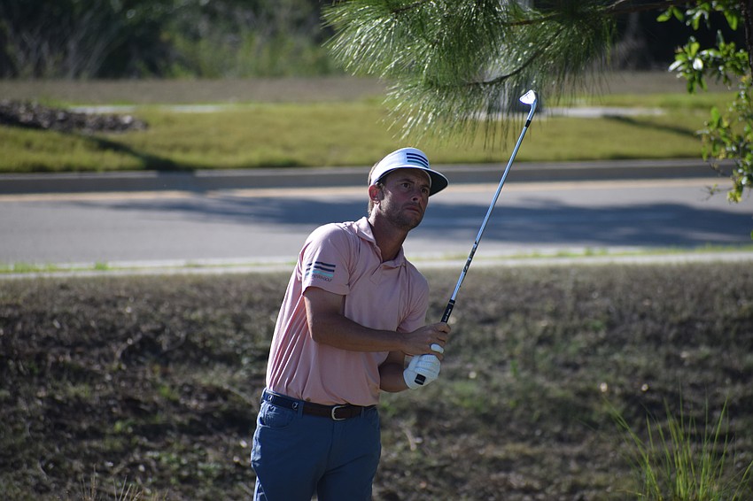 Spencer Levin watches as his ball rolls toward the pin on the par-3 No. 15 at Lakewood National. Levin shot 75.