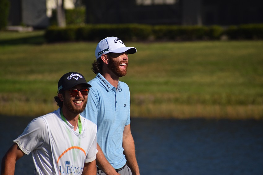 Korn Ferry Golfer Marcus Plunkett (back) smiles after sinking a putt on No. 11 at Lakewood National in Wednesday's first round of the LECOM Suncoast Classic. He shot 69.
