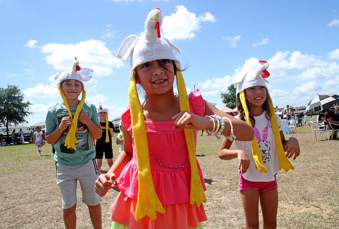 Seven-year-old Anabella Cardenas, center, loved doing the Chicken Dance.