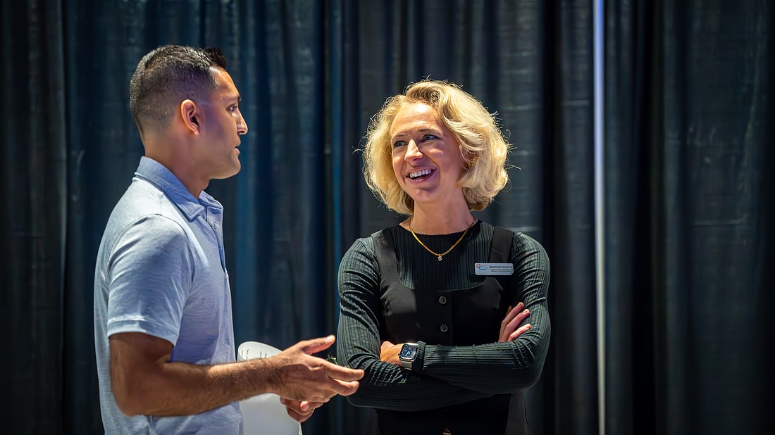 Commissioner Tal Siddique and Director of Government Relations Stephanie Garrison chat at the Employee Recognition Banquet in March.