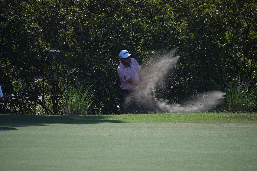 Dan McCarthy punches out near the brush on No. 14 at Lakewood National Thursday during the second round of the LECOM Suncoast Classic.
